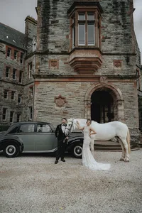 Ireland castle with bride and groom in front with horse and car
