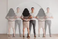 Two people stand in opposite directions