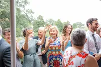 Wedding guests smiling and clapping
