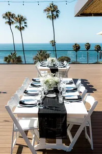 wedding table and centerpieces with palm trees in the background at San Diego wedding
