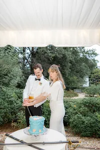 Bride and groom cutting their wedding cake
