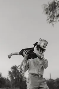 Corey Combs holding his daughter in Manchester, Vermont