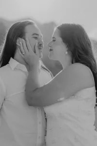 Black and white close up of girl holding guy's face in Nevada