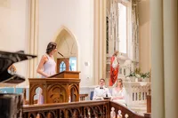 Lady speaking at podium in wedding chapel