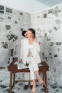 A couple sits at a desk together