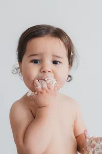 A kid eats cake.