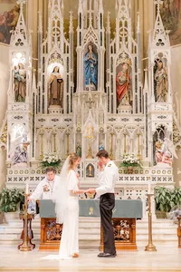 Bride and groom at chapel alter