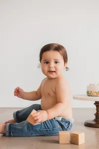 A little boy plays with blocks.