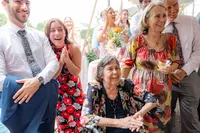 Wedding guests smiling and clapping