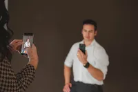 A person takes a photo with their phone
