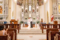 Bride and groom kissing in chapel