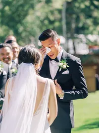 groom tearing up at the wedding ceremony