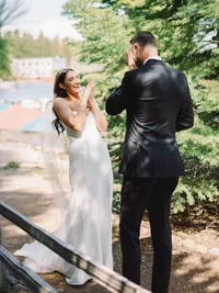 brides reaction to grooms reaction to her dress at their first look