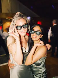 wedding guests posing with wedding sunglasses