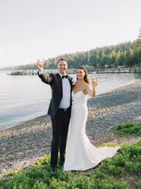 bride and groom cheering on Gar Woods beach