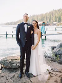 stylish wedding portrait of bride and groom on lake Tahoe beach