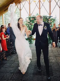 bride and groom very happy walking after their wedding ceremony
