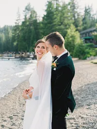 bride and groom looking at each other on lake tahoe beach