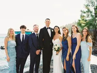 bride and groom posing with bridal party on Gar Woods beach