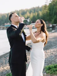 Bride and Groom drinking champagne on Gar Woods beach