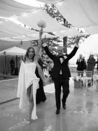Bride and groom screaming yeeeyyy after just getting married