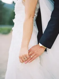 photo shot on film of bride and groom hands