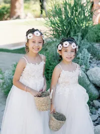 flower girls smiling for the camera