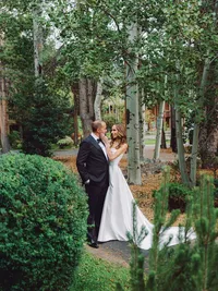 bride and groom portraits in the woodsy green area