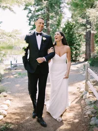 bride and groom laughing and walking