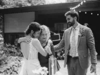 bride is hugging her grandma after she gave beautiful speech at waterfall lodge