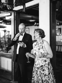 brides parents giving funny speech at the wedding reception