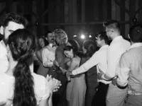 guests having fun and hugging during wedding reception dances