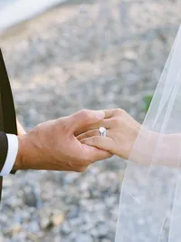 film photo of groom holding brides hand
