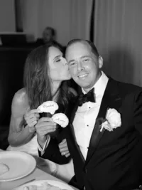 bride kissing groom on the cheek during their wedding reception at the landing resort Tahoe
