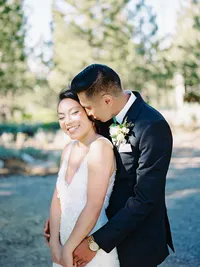 film photo of groom kissing brides cheek