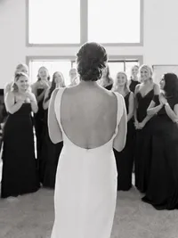 brides dress reveal to her bridesmaids