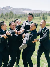 groom and groomsmen messing around