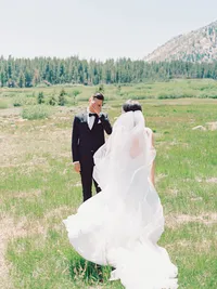 groom looking at the bride and tearing up during first look