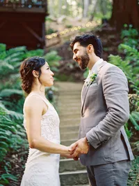 bride and groom holding hands