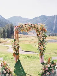 Gorgeous full flower wedding arch at the Everline resort Tahoe
