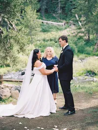 bride and groom holding hands at their wedding ceremony