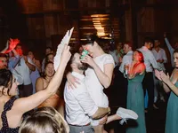 groom picked up bride and laughing at each other during their wedding reception