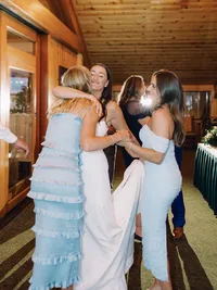 bride and bridesmaids dancing during wedding reception