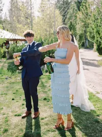 wedding guests opening champagne