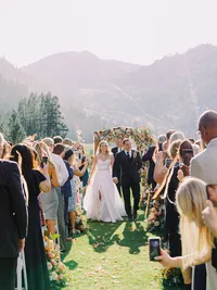 bride and groom walking down the isle