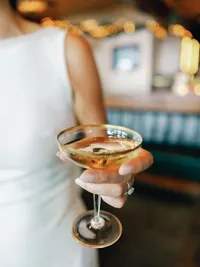 bride golding champagne glass which was her grandmas during her wedding reception