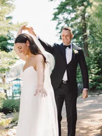 groom twirling bride during their first look