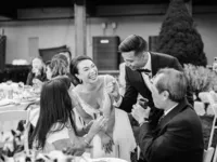 bride and groom interacting with guests