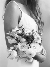 black and white film photo of bride holding bouquet