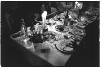 Cinematic wedding photography of tables with candle light dramatic tones at Brunswick house winter wedding